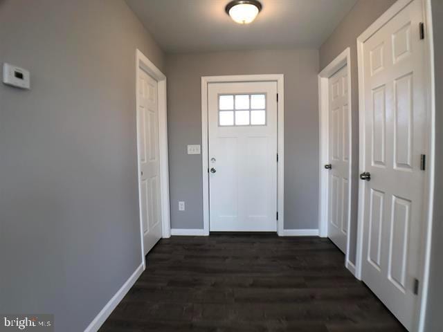 doorway to outside featuring dark hardwood / wood-style floors