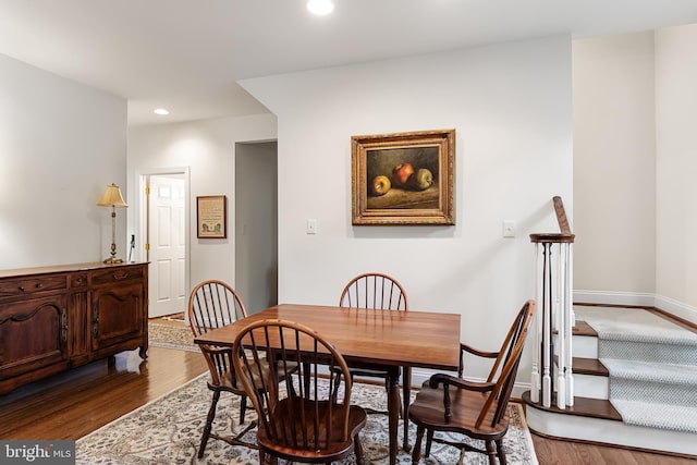 dining area with hardwood / wood-style floors