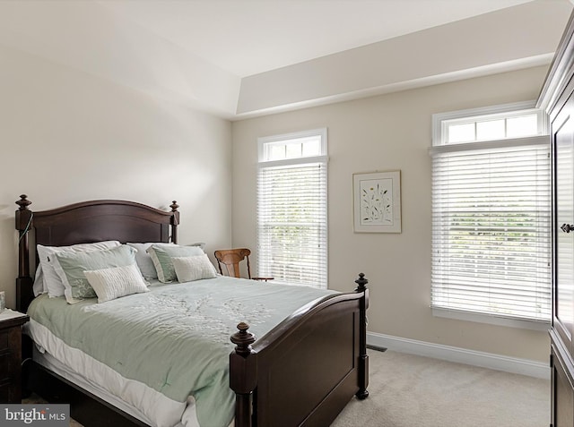 bedroom featuring light colored carpet