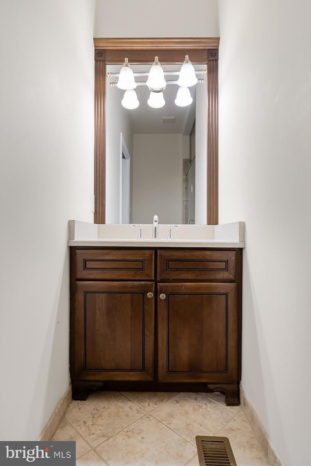 bathroom with tile patterned floors and vanity