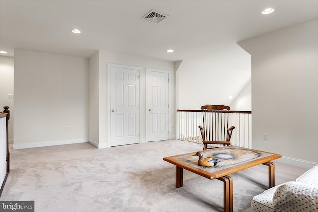 unfurnished room with light colored carpet