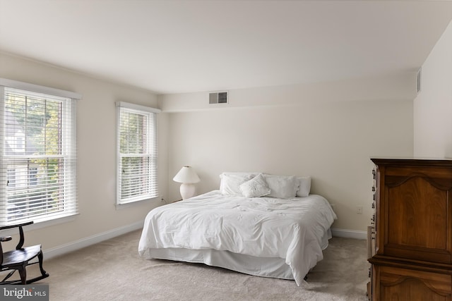 bedroom with light carpet