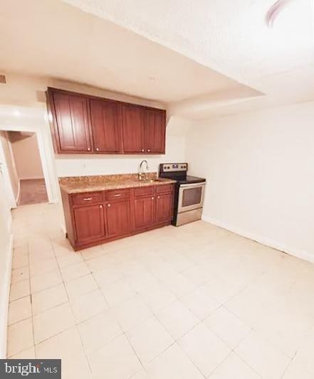 kitchen with sink and electric range