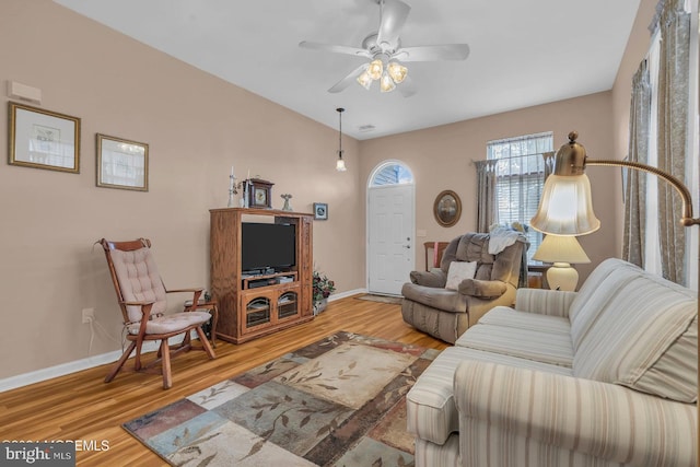 living room with hardwood / wood-style floors and ceiling fan