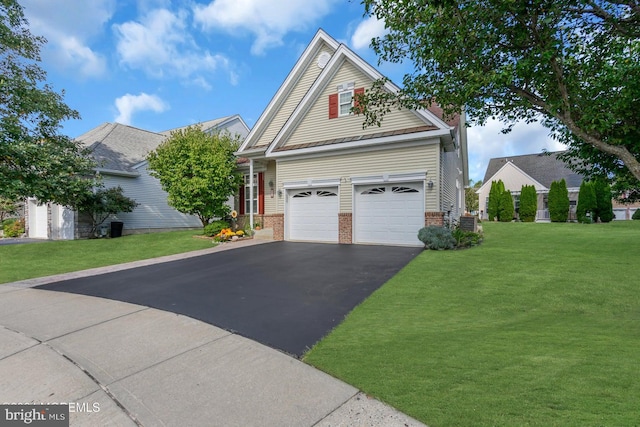 view of front facade with a front lawn and a garage