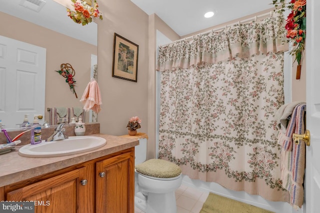 full bathroom with vanity, shower / bathtub combination with curtain, toilet, and tile patterned floors