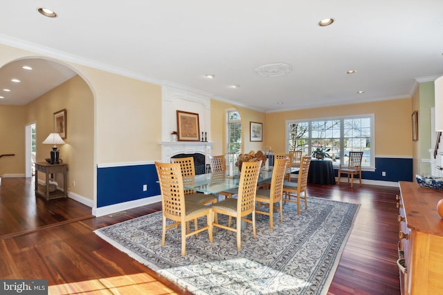 216 Chew E, Saint Michaels, MD 21663 - dining room with arched walkways, baseboards, wood finished floors, recessed lighting, and crown molding