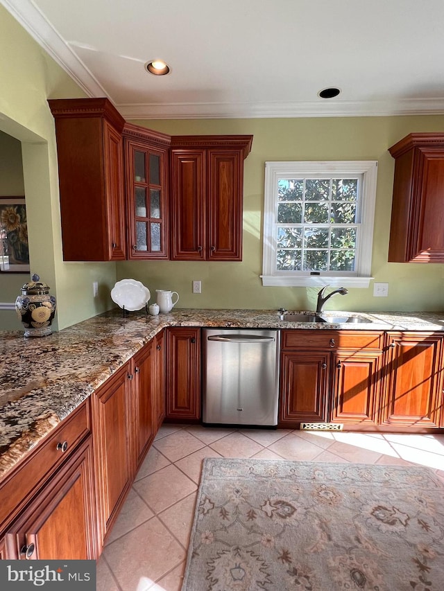 kitchen with light tile patterned floors, sink, dishwasher, and ornamental molding