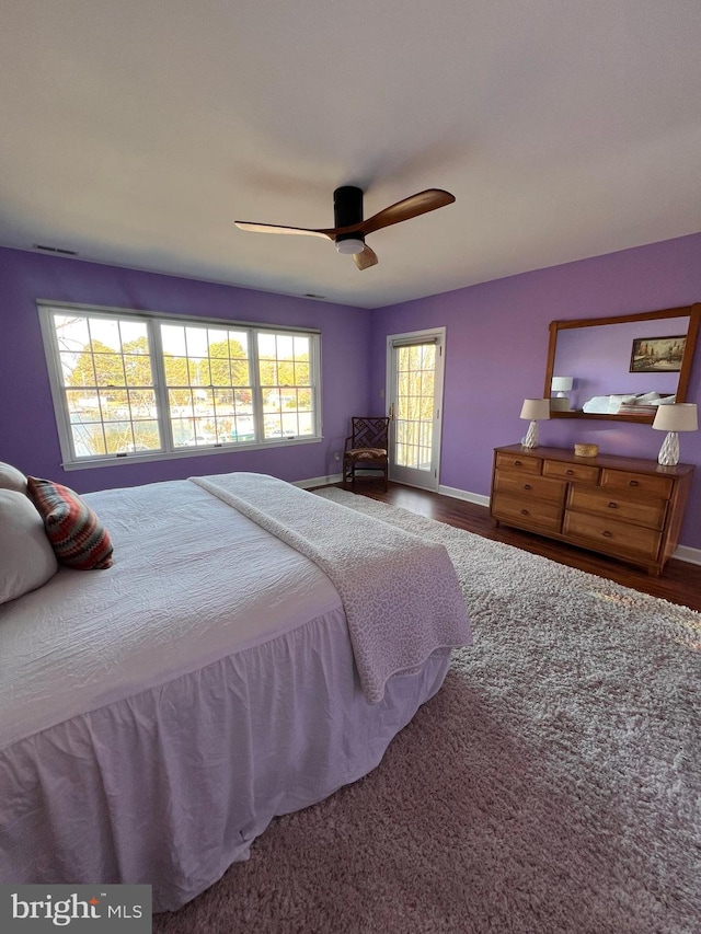 bedroom with ceiling fan and carpet floors