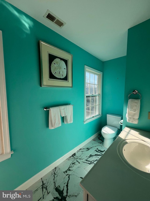 bathroom with vanity and toilet