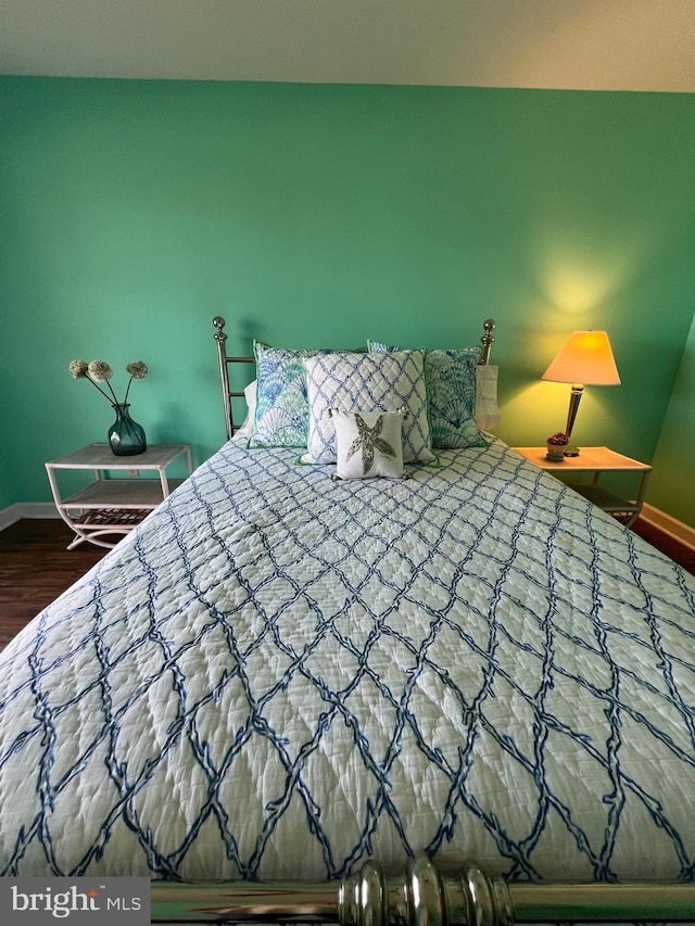 unfurnished bedroom with wood-type flooring