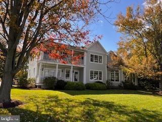 view of front of home with a front yard