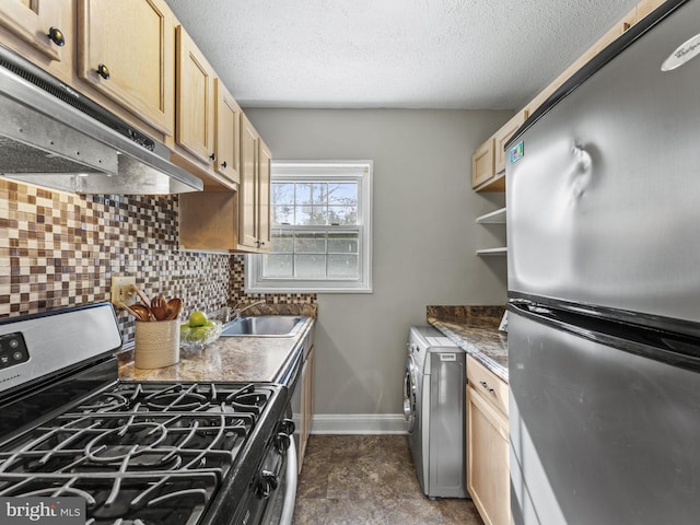 kitchen featuring backsplash, stainless steel appliances, sink, light brown cabinets, and washer / clothes dryer