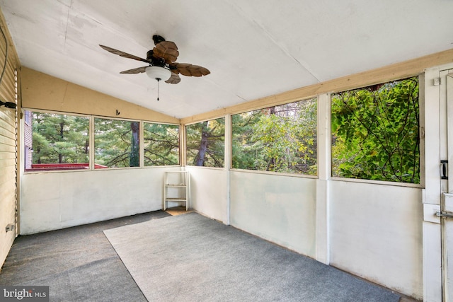 unfurnished sunroom featuring lofted ceiling and ceiling fan