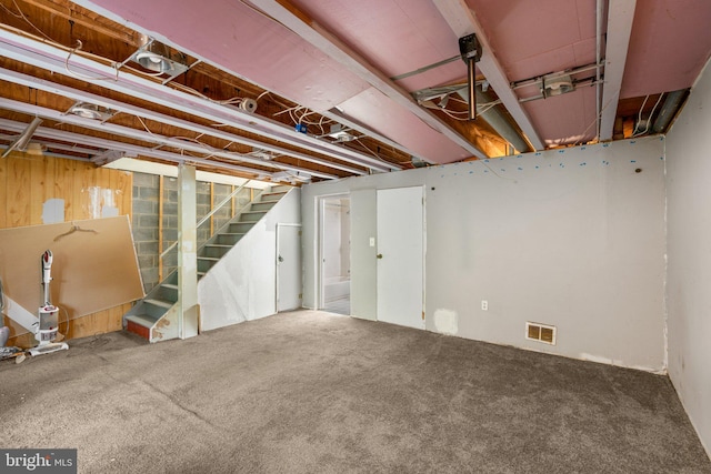 basement featuring carpet flooring