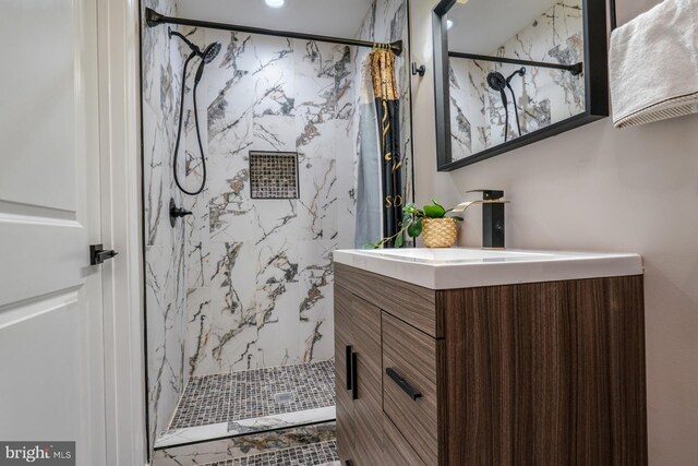 bathroom featuring vanity and curtained shower