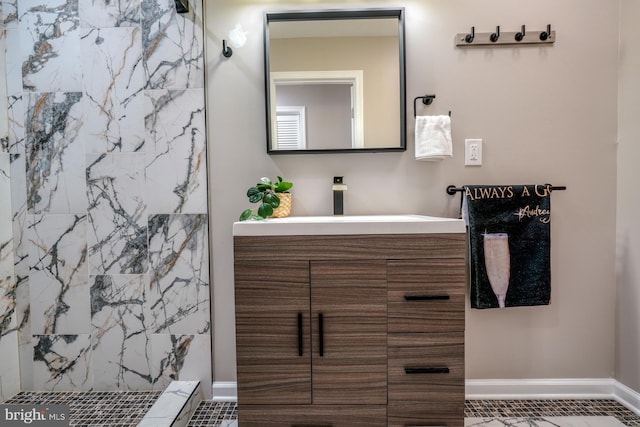 bathroom with vanity, walk in shower, and tile patterned floors