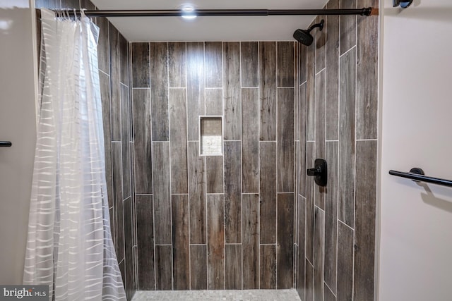 bathroom featuring a shower with curtain