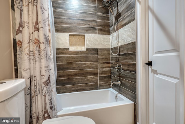 bathroom with toilet and shower / bath combo