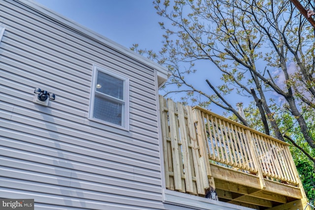 view of home's exterior with a wooden deck