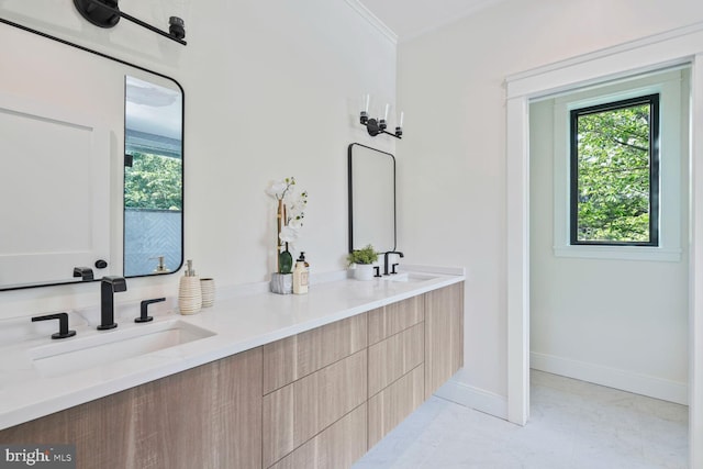 6019 Utah Ave NW, Washington, DC 20015 - bathroom with plenty of natural light, double vanity, marble finish floors, baseboards, and ornamental molding