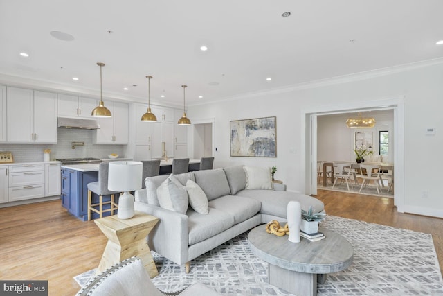 6019 Utah Ave NW, Washington, DC 20015 - living room featuring light wood-style flooring, crown molding, recessed lighting, and a chandelier