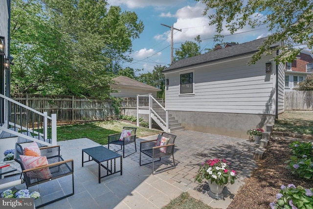 6019 Utah Ave NW, Washington, DC 20015 - fenced backyard featuring an outdoor living space, stairs, and a patio