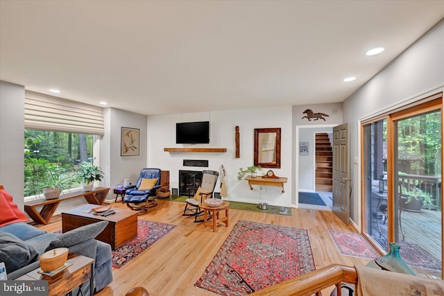 living room with plenty of natural light and hardwood / wood-style floors