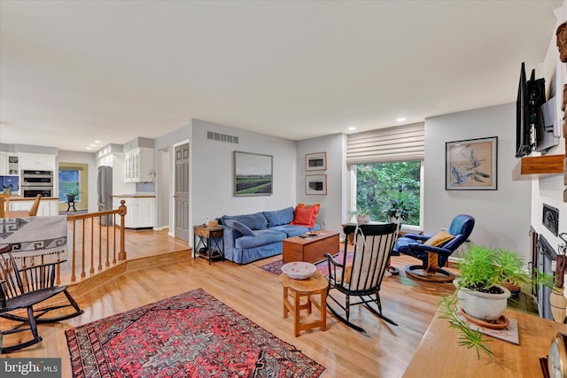 living room with light hardwood / wood-style floors