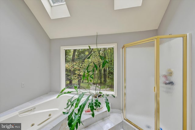 bathroom featuring lofted ceiling, shower with separate bathtub, and tile patterned floors