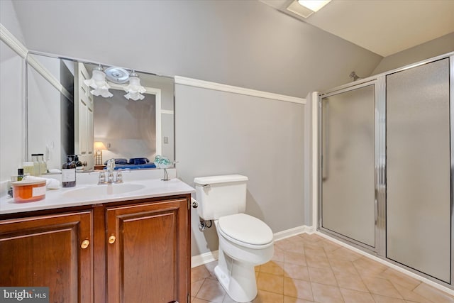 bathroom with vanity, toilet, a shower with door, and tile patterned floors