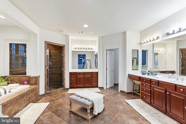 bathroom featuring vanity and separate shower and tub