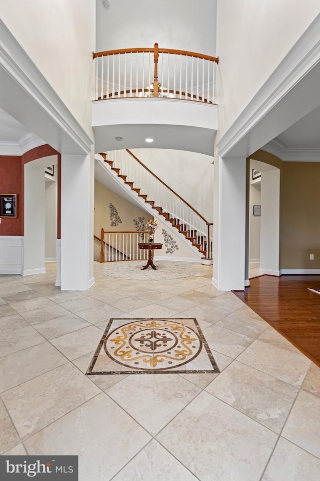 foyer entrance featuring crown molding