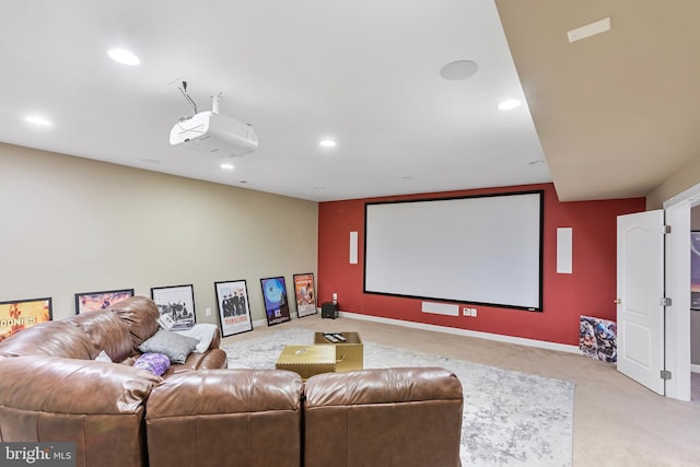 home theater room featuring light colored carpet