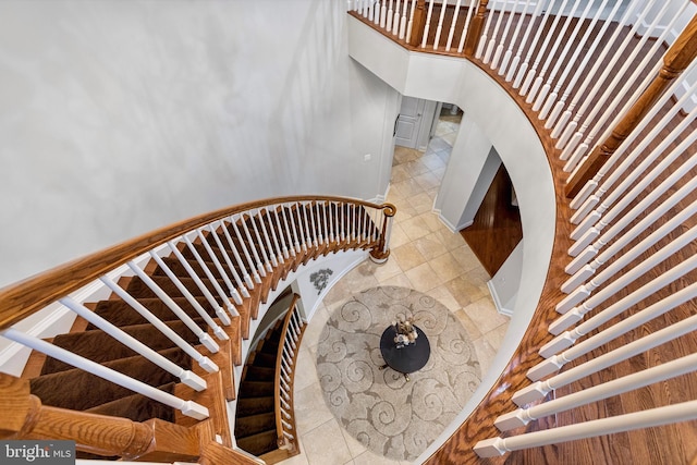 stairway featuring tile patterned floors