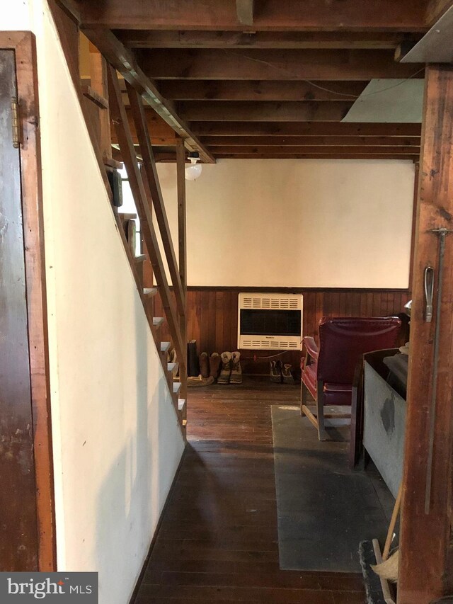 174 Jamison City Rd, Benton, PA 17814 - basement featuring wooden walls, heating unit, and dark wood-type flooring