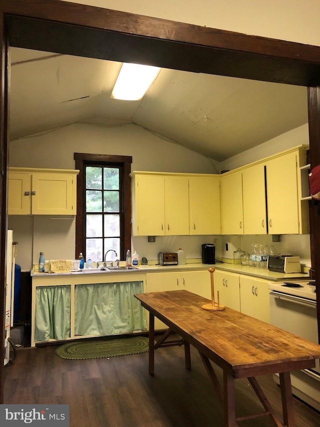 174 Jamison City Rd, Benton, PA 17814 - kitchen featuring sink, dark wood-type flooring, stove, lofted ceiling, and white cabinets