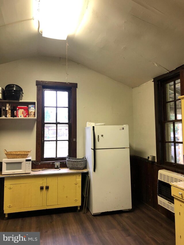 174 Jamison City Rd, Benton, PA 17814 - kitchen featuring heating unit, lofted ceiling, dark wood-type flooring, and white appliances
