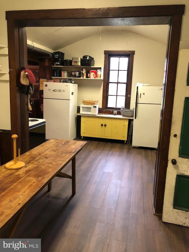 174 Jamison City Rd, Benton, PA 17814 - kitchen featuring dark hardwood / wood-style flooring, white appliances, and vaulted ceiling