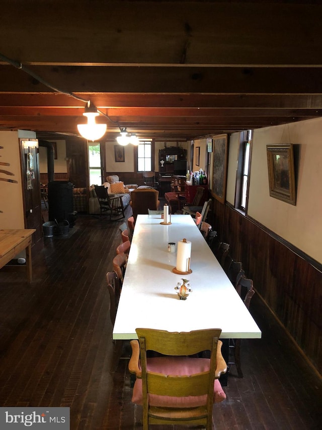 174 Jamison City Rd, Benton, PA 17814 - dining area with wood walls and dark wood-type flooring