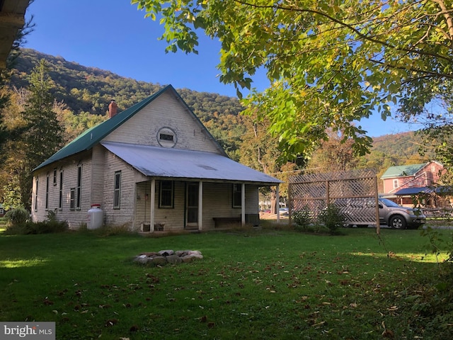 174 Jamison City Rd, Benton, PA 17814 - rear view of house with a mountain view and a yard