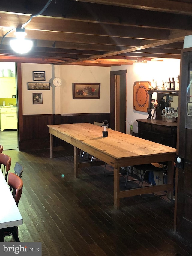 174 Jamison City Rd, Benton, PA 17814 - dining area featuring wood walls, wood-type flooring, and beam ceiling