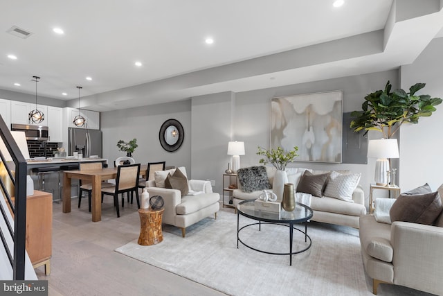 living room with light hardwood / wood-style floors