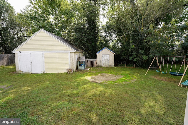 view of yard featuring a shed and a playground