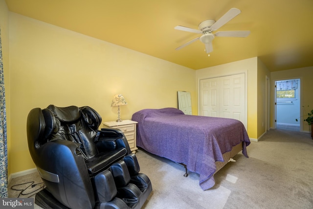 carpeted bedroom with a closet and ceiling fan