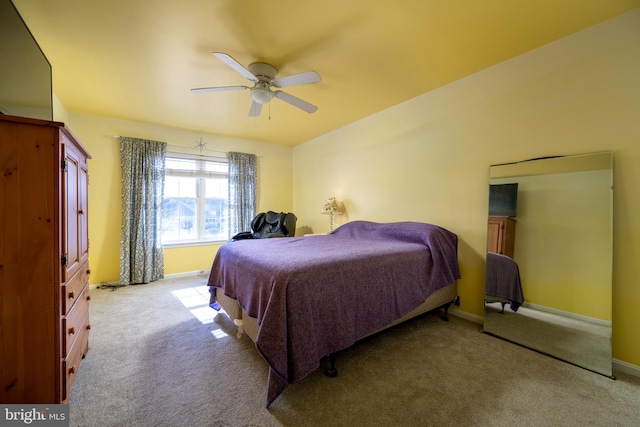 bedroom featuring light carpet and ceiling fan