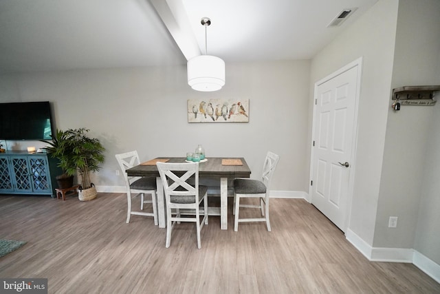 dining space featuring hardwood / wood-style flooring