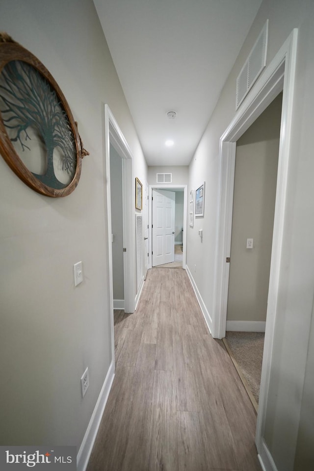 corridor featuring light hardwood / wood-style flooring