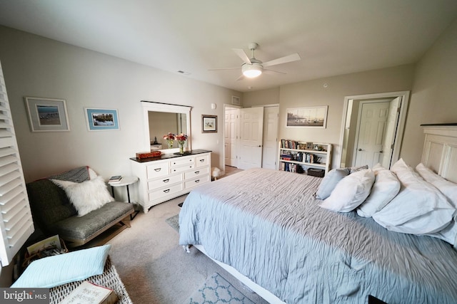 carpeted bedroom with ceiling fan