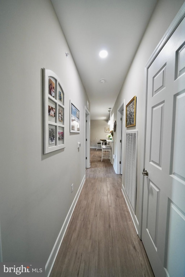 hall with wood-type flooring